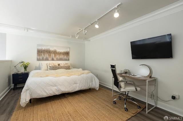 bedroom featuring dark hardwood / wood-style flooring and crown molding