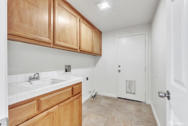 4737 Crestone Peak Dr, Antioch, CA 94531 - clothes washing area with baseboards, hookup for a washing machine, a sink, cabinet space, and hookup for an electric dryer