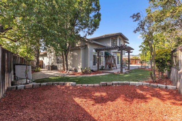 4737 Crestone Peak Dr, Antioch, CA 94531 - rear view of house with a patio, a fenced backyard, a yard, and a pergola
