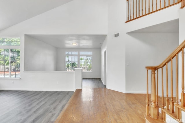 4737 Crestone Peak Dr, Antioch, CA 94531 - entrance foyer featuring high vaulted ceiling, visible vents, and wood finished floors