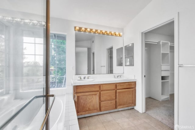 4737 Crestone Peak Dr, Antioch, CA 94531 - full bath featuring a sink, double vanity, tile patterned floors, a tub, and a spacious closet