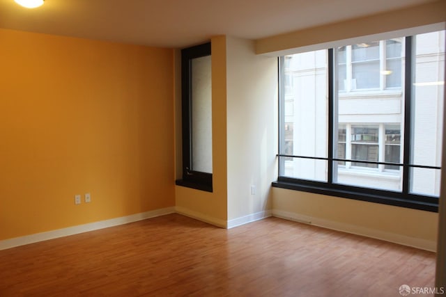 spare room featuring hardwood / wood-style floors