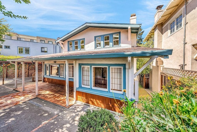 3779 Park Boulevard Way, Oakland, CA 94610 - view of front of home with a chimney, a patio area, and stucco siding