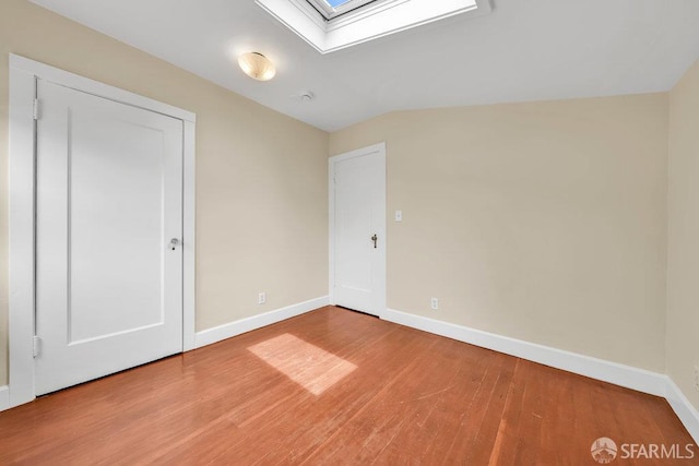 3779 Park Boulevard Way, Oakland, CA 94610 - unfurnished bedroom featuring a skylight and wood finished floors