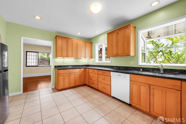 3779 Park Boulevard Way, Oakland, CA 94610 - kitchen featuring white dishwasher, light tile patterned floors, recessed lighting, and dark stone countertops