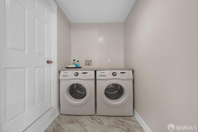 3779 Park Boulevard Way, Oakland, CA 94610 - laundry area featuring washer and dryer and light marble finish floors