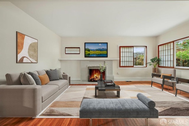3779 Park Boulevard Way, Oakland, CA 94610 - living room featuring a brick fireplace and wood finished floors