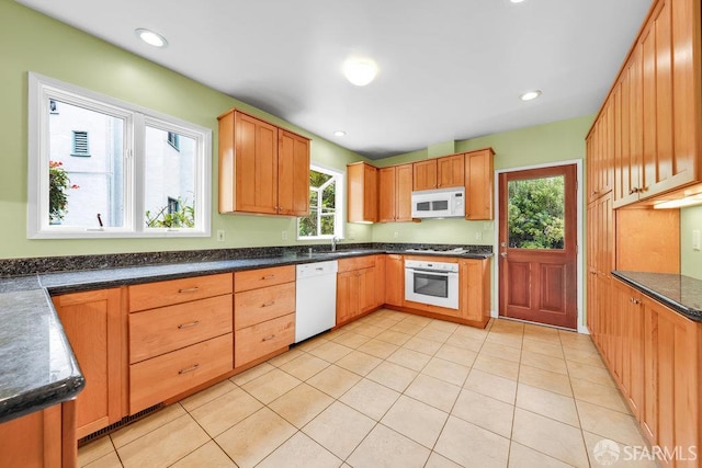 3779 Park Boulevard Way, Oakland, CA 94610 - kitchen featuring white appliances, light tile patterned floors, and recessed lighting