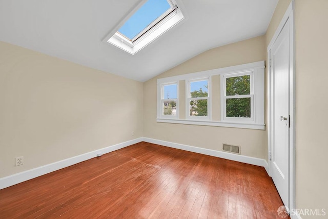 3779 Park Boulevard Way, Oakland, CA 94610 - unfurnished bedroom featuring vaulted ceiling, a skylight, and hardwood / wood-style flooring