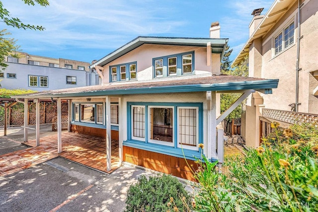 3779 Park Boulevard Way, Oakland, CA 94610 - view of front of property with a chimney, a patio, and stucco siding