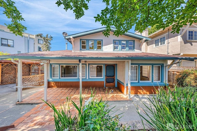3779 Park Boulevard Way, Oakland, CA 94610 - view of front of home with stucco siding, a chimney, and a patio