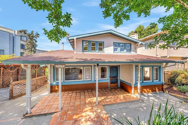 3779 Park Boulevard Way, Oakland, CA 94610 - view of front facade featuring roof with shingles, stucco siding, and a porch