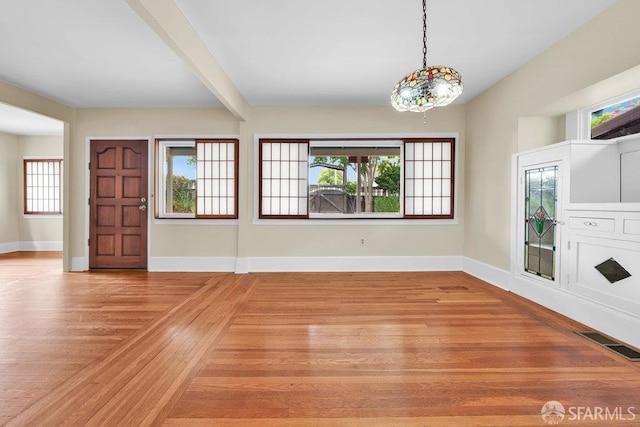 3779 Park Boulevard Way, Oakland, CA 94610 - unfurnished living room with baseboards and light wood-style floors