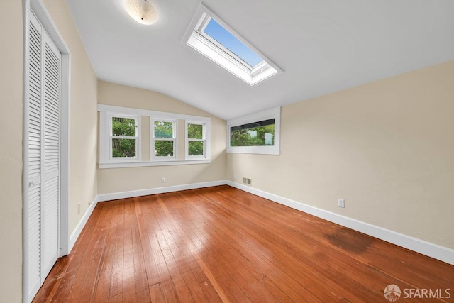 3779 Park Boulevard Way, Oakland, CA 94610 - unfurnished bedroom with lofted ceiling, a skylight, hardwood / wood-style flooring, and a closet