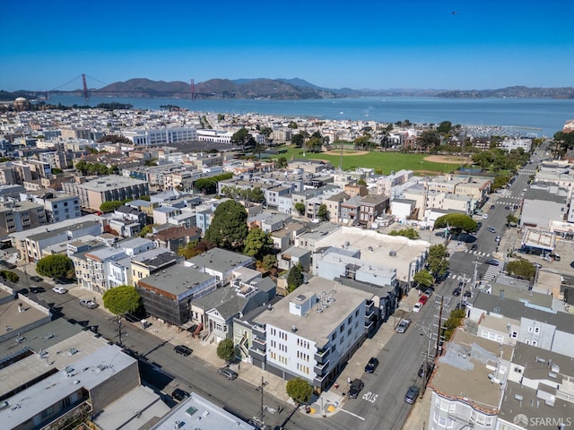 aerial view featuring a water and mountain view