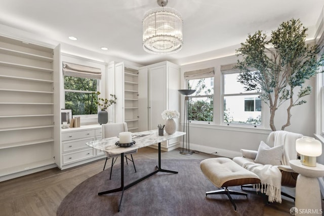 office space featuring recessed lighting, baseboards, plenty of natural light, and an inviting chandelier