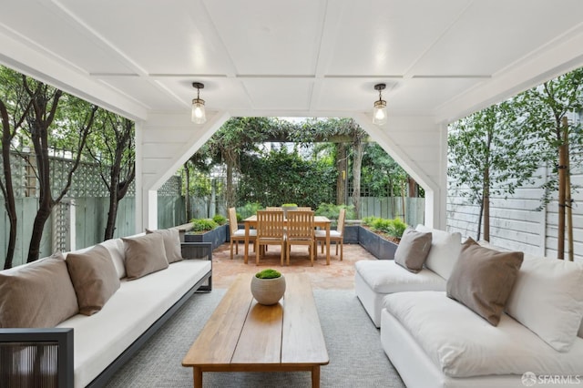 view of patio featuring outdoor dining area, a fenced backyard, and an outdoor hangout area