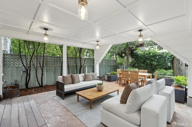 view of patio / terrace with outdoor dining space, outdoor lounge area, and a fenced backyard