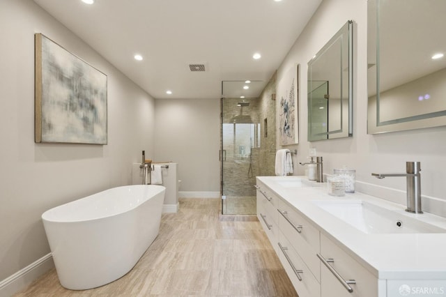 bathroom with plus walk in shower and vanity