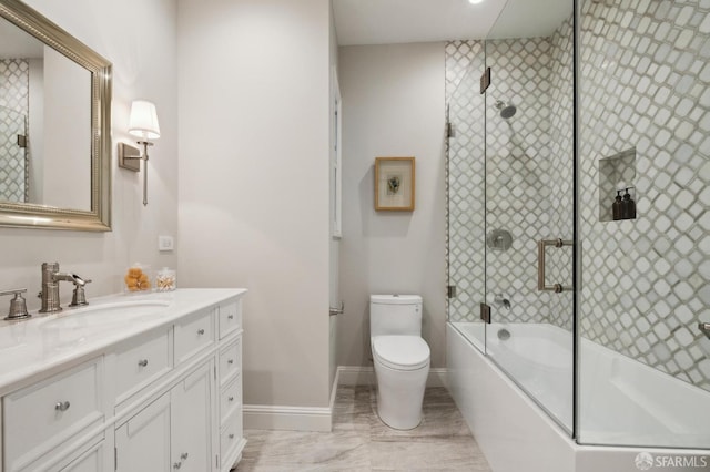 full bathroom with vanity, toilet, and enclosed tub / shower combo