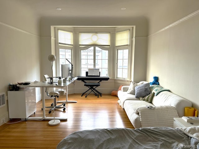 office space with plenty of natural light and light wood-type flooring