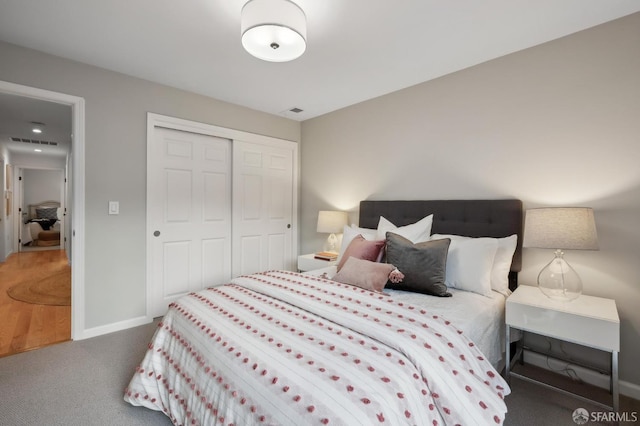 bedroom featuring a closet and carpet