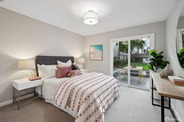 bedroom with carpet floors and access to outside