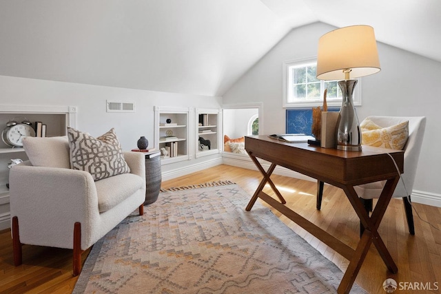 1758 Palou Ave, San Francisco, CA 94124 - office area featuring wood finished floors, lofted ceiling, and built in features
