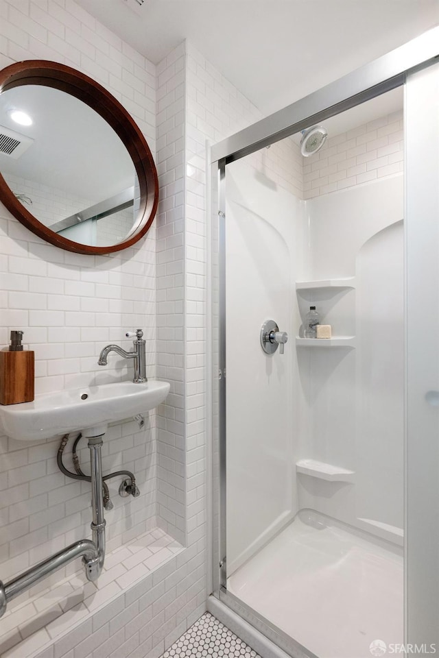 1758 Palou Ave, San Francisco, CA 94124 - bathroom featuring a stall shower, tile walls, and tile patterned flooring