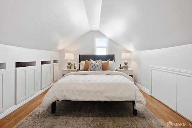 1758 Palou Ave, San Francisco, CA 94124 - bedroom with vaulted ceiling and light wood-style floors