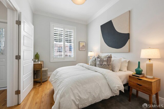 1758 Palou Ave, San Francisco, CA 94124 - bedroom featuring ornamental molding, light wood-style flooring, and baseboards