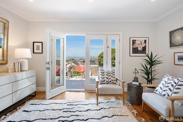 1758 Palou Ave, San Francisco, CA 94124 - sitting room featuring light wood-type flooring, crown molding, baseboards, and recessed lighting