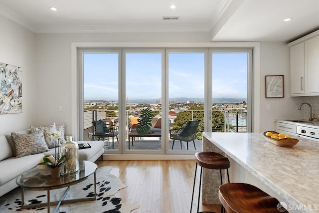 1758 Palou Ave, San Francisco, CA 94124 - living area with light wood-style floors, recessed lighting, and crown molding