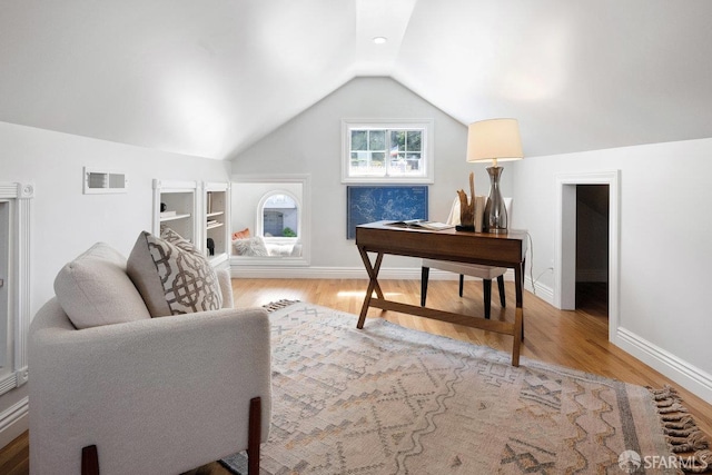 1758 Palou Ave, San Francisco, CA 94124 - living area with wood finished floors, lofted ceiling, a desk, baseboards, and built in features