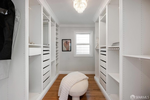 1758 Palou Ave, San Francisco, CA 94124 - walk in closet featuring wood finished floors and a chandelier