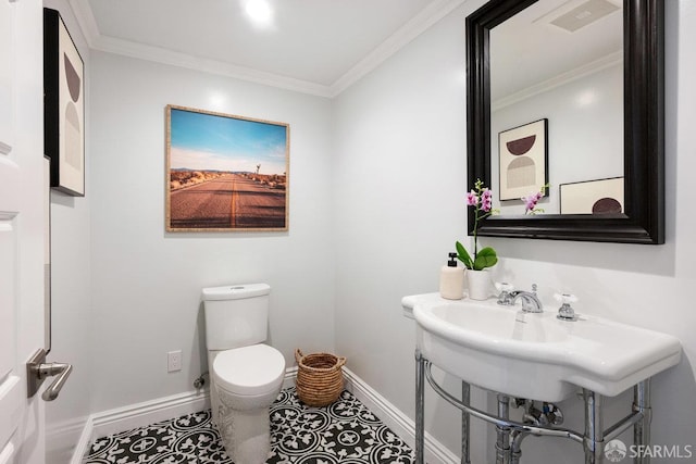 1758 Palou Ave, San Francisco, CA 94124 - half bathroom with baseboards, toilet, ornamental molding, and tile patterned floors