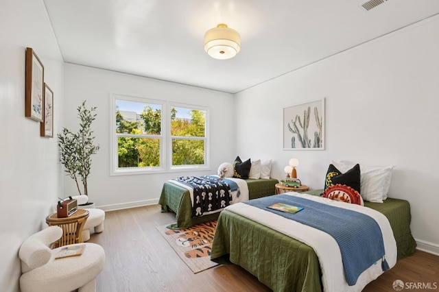 67 Rome St, San Francisco, CA 94112 - bedroom with wood finished floors and baseboards