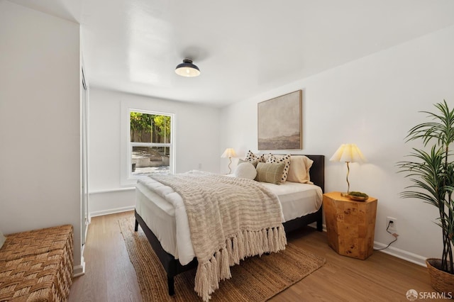 67 Rome St, San Francisco, CA 94112 - bedroom with light wood finished floors and baseboards