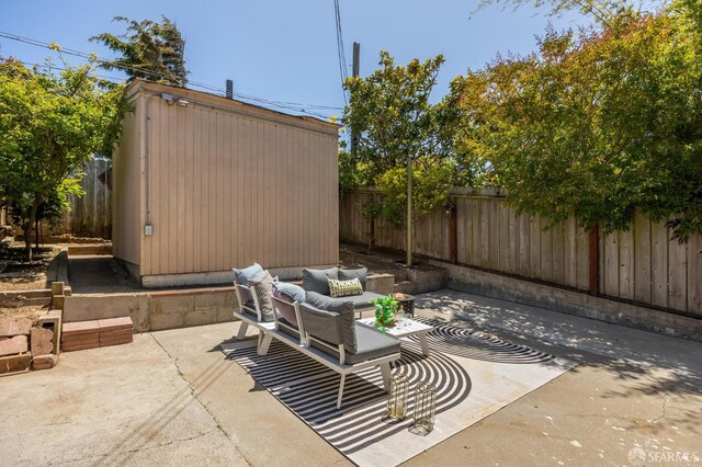 67 Rome St, San Francisco, CA 94112 - fenced backyard with a patio area, outdoor lounge area, and a shed