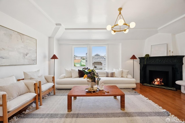 67 Rome St, San Francisco, CA 94112 - living room with wood finished floors, a chandelier, and a lit fireplace