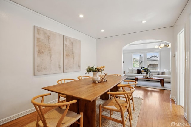 67 Rome St, San Francisco, CA 94112 - dining room with arched walkways, light wood-type flooring, and recessed lighting