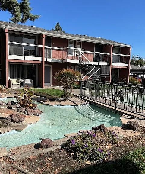 pool featuring stairs and a patio