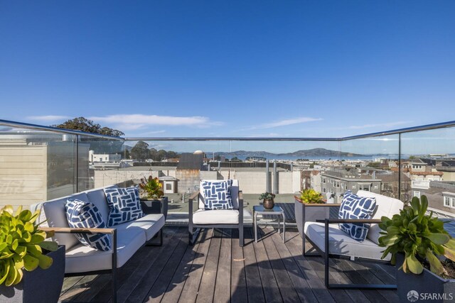 wooden terrace featuring an outdoor living space