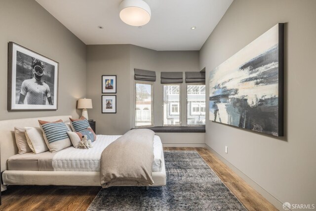 bedroom with wood finished floors