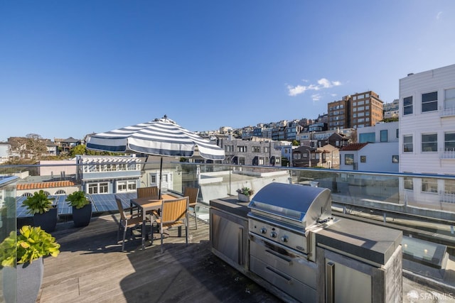 wooden terrace with area for grilling