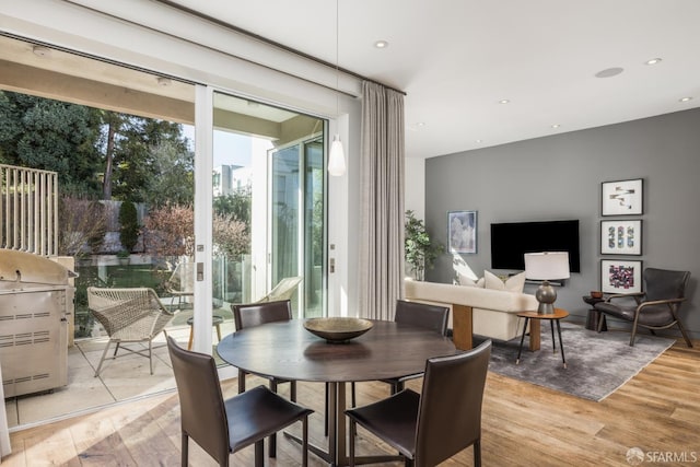 dining area featuring recessed lighting and light wood-style floors