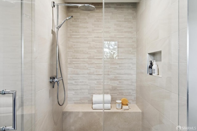 full bath featuring a shower stall