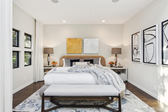 bedroom featuring baseboards, dark wood-style flooring, and recessed lighting