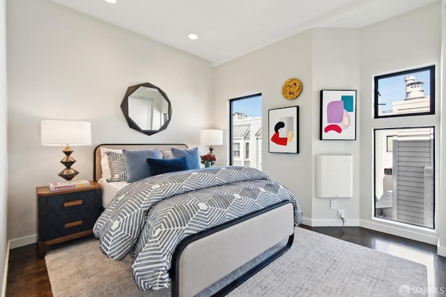 bedroom featuring dark wood-style flooring, recessed lighting, and baseboards