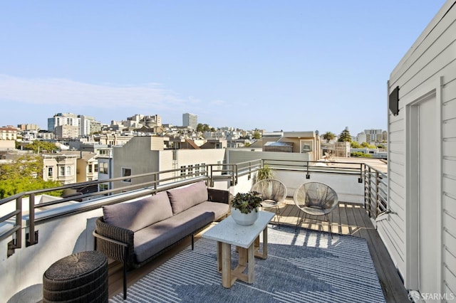 balcony featuring a view of city and outdoor lounge area